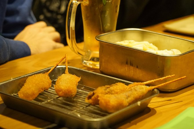 Osaka Local Foodie Walking Tour in Dotonbori and Shinsekai - Discovering Dotonboris Vibrant Scene